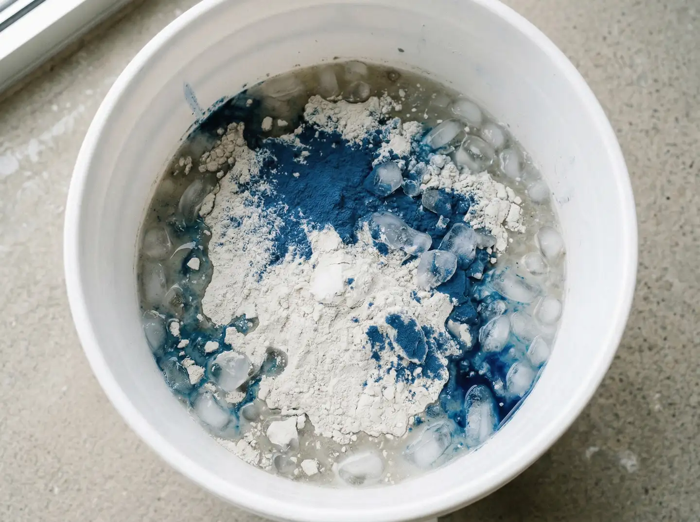 Integral pigment being mixed into UHPC concrete